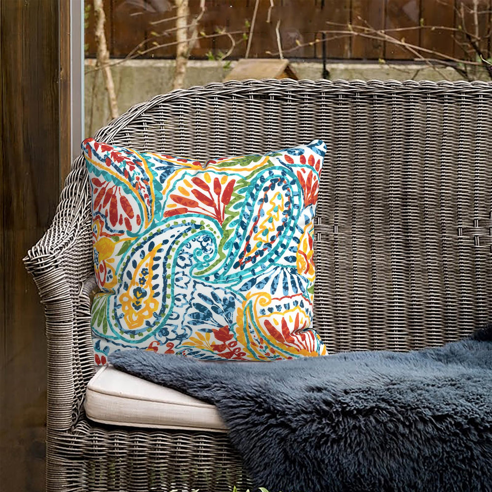 TWLEAR pillows arranged in a garden setting showing outdoor styling benefit