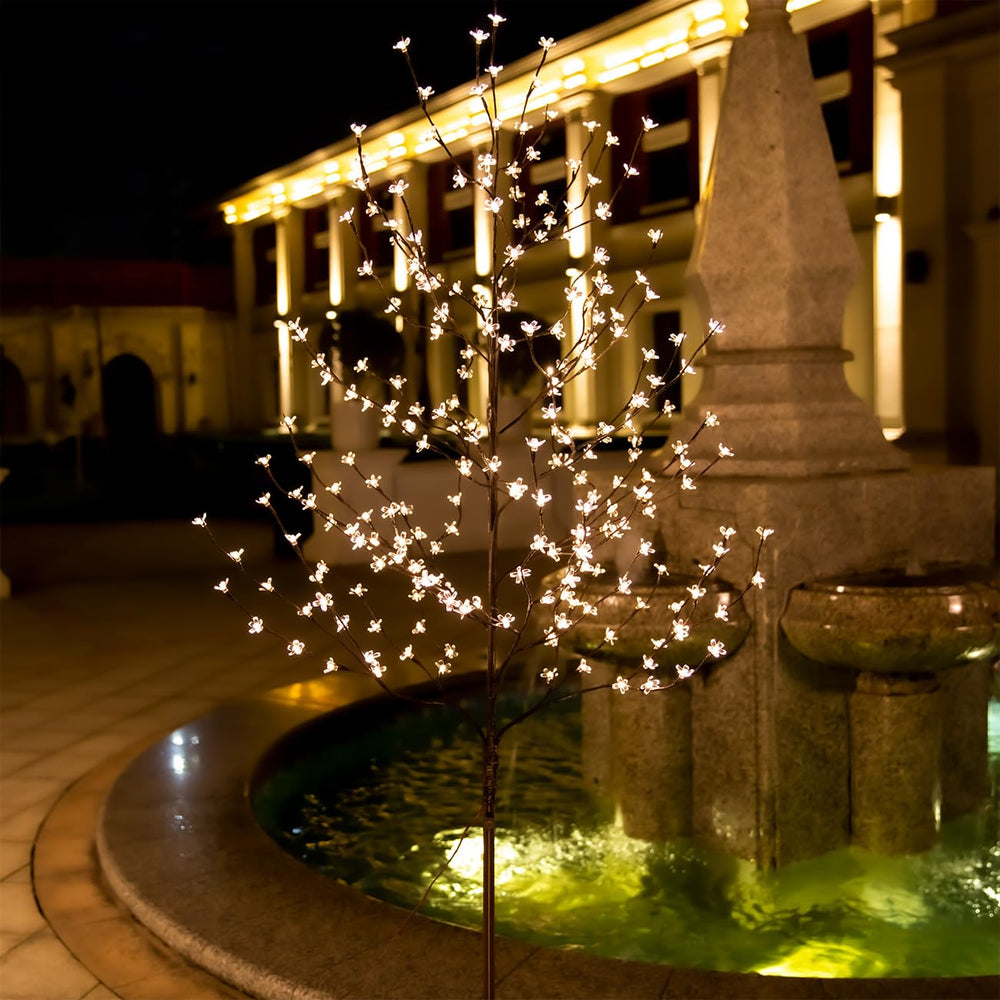 TYBEEU tree at night casting warm ambient glow for cozy environments
