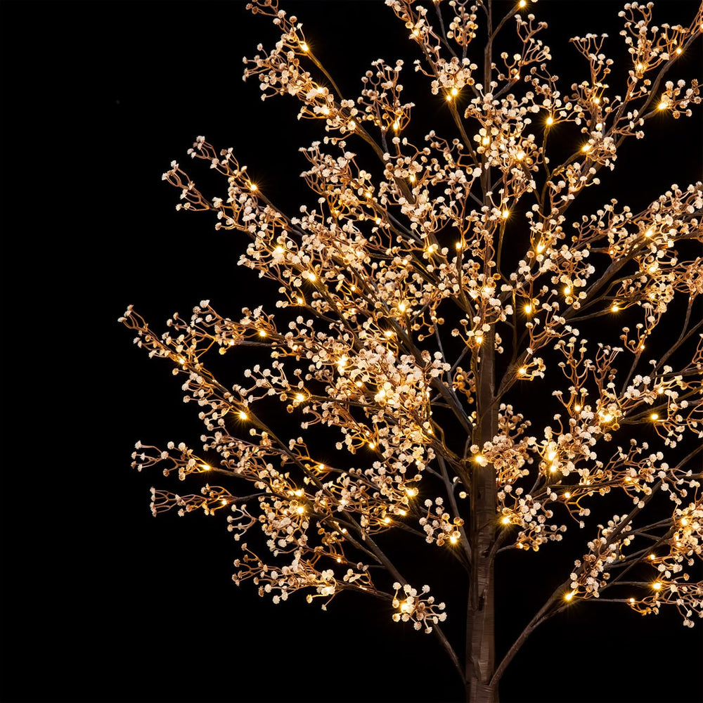 TYBEEU tree next to sofa showing five-foot scale and cozy ambient lighting