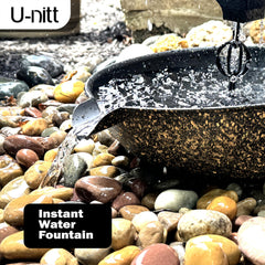 U-nitt basin installed under downspout anchoring rain chain and stabilizing flow