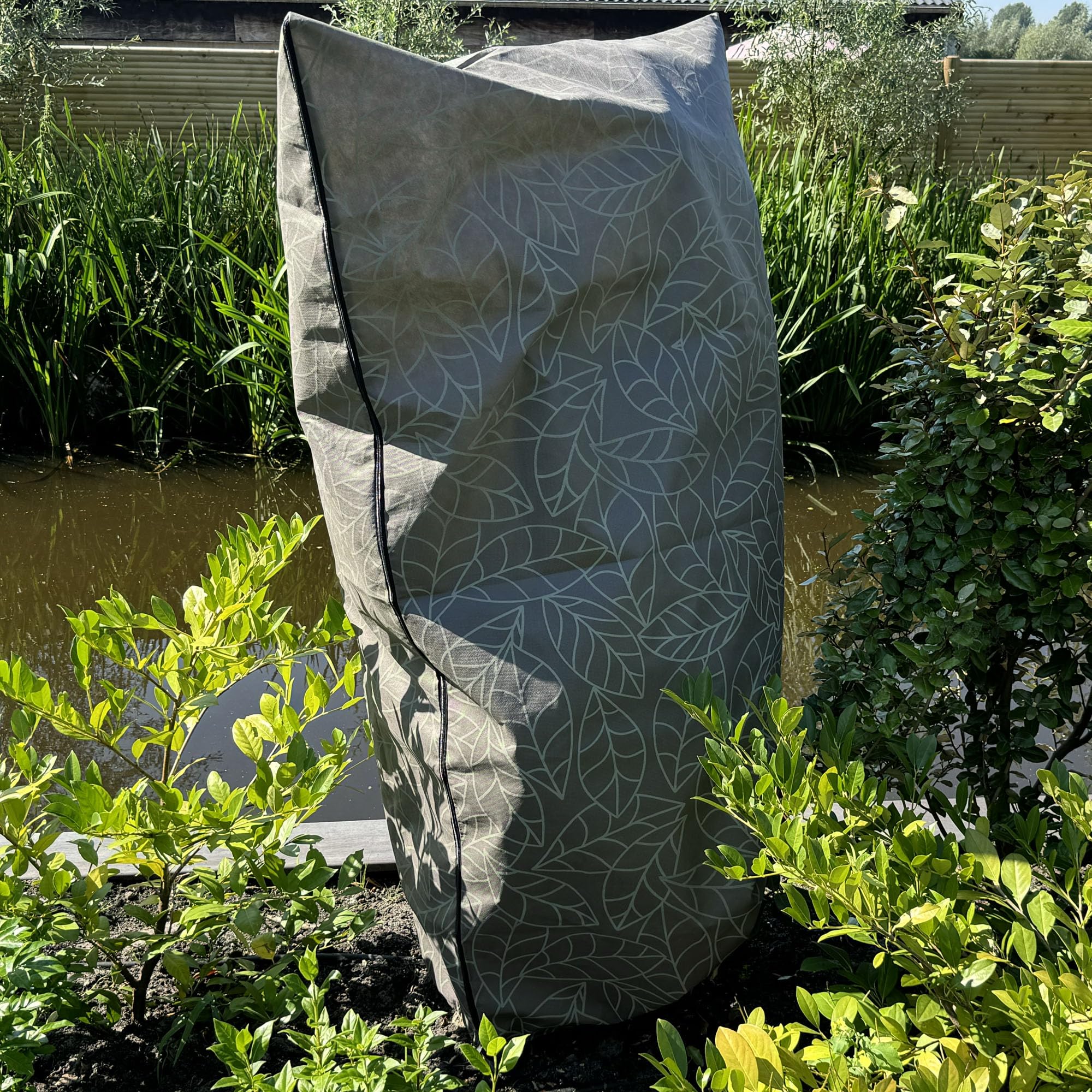 UB-STORE plant cover installed over garden shrub protecting from frost