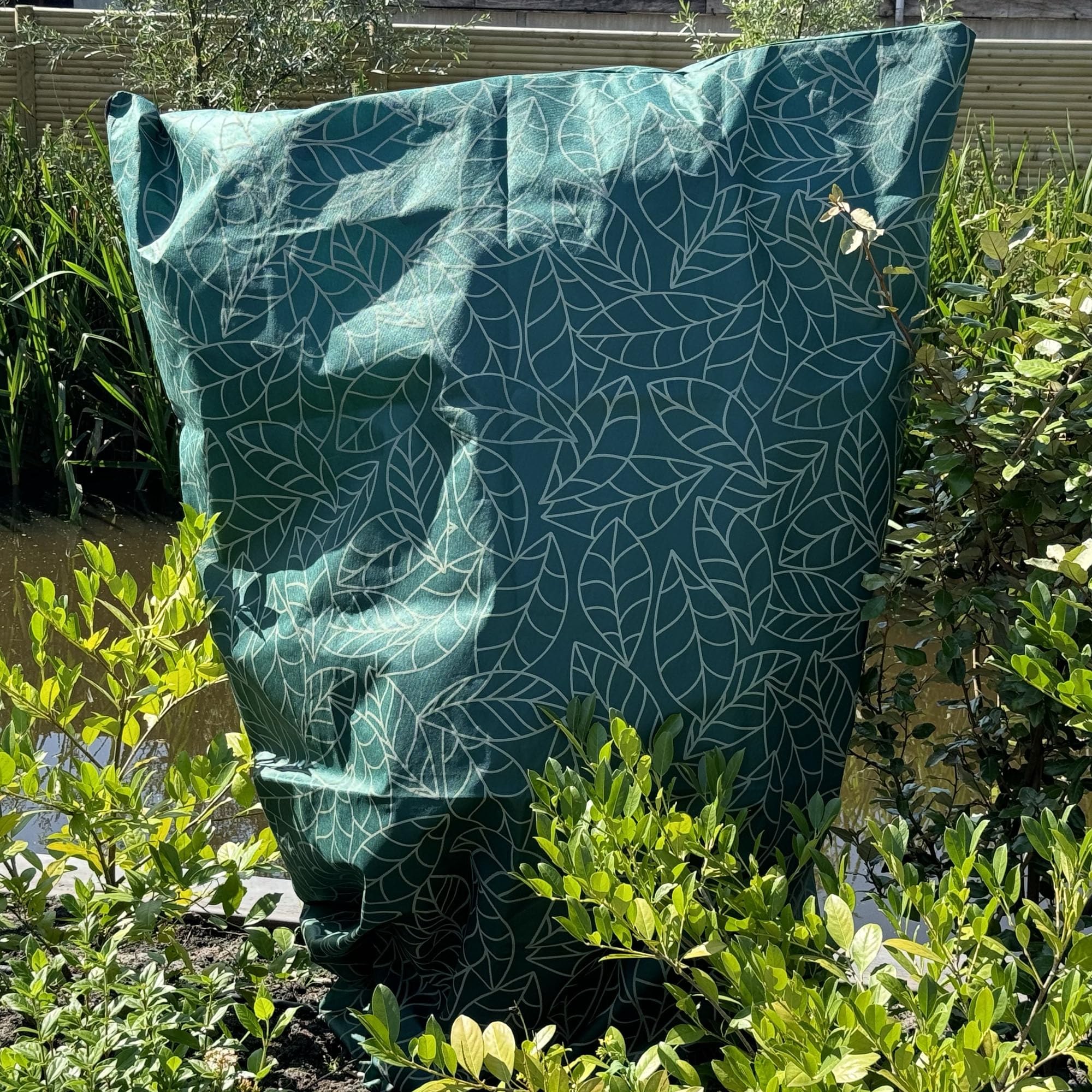 UB-STORE cover installed on shrub demonstrating frost protection and breathable fit