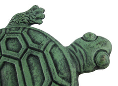 UD turtle placed among plants showing how it blends with garden beds and pathways