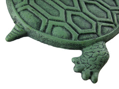 UD turtle next to a ruler demonstrating 13 by 9 inch size for scale and placement