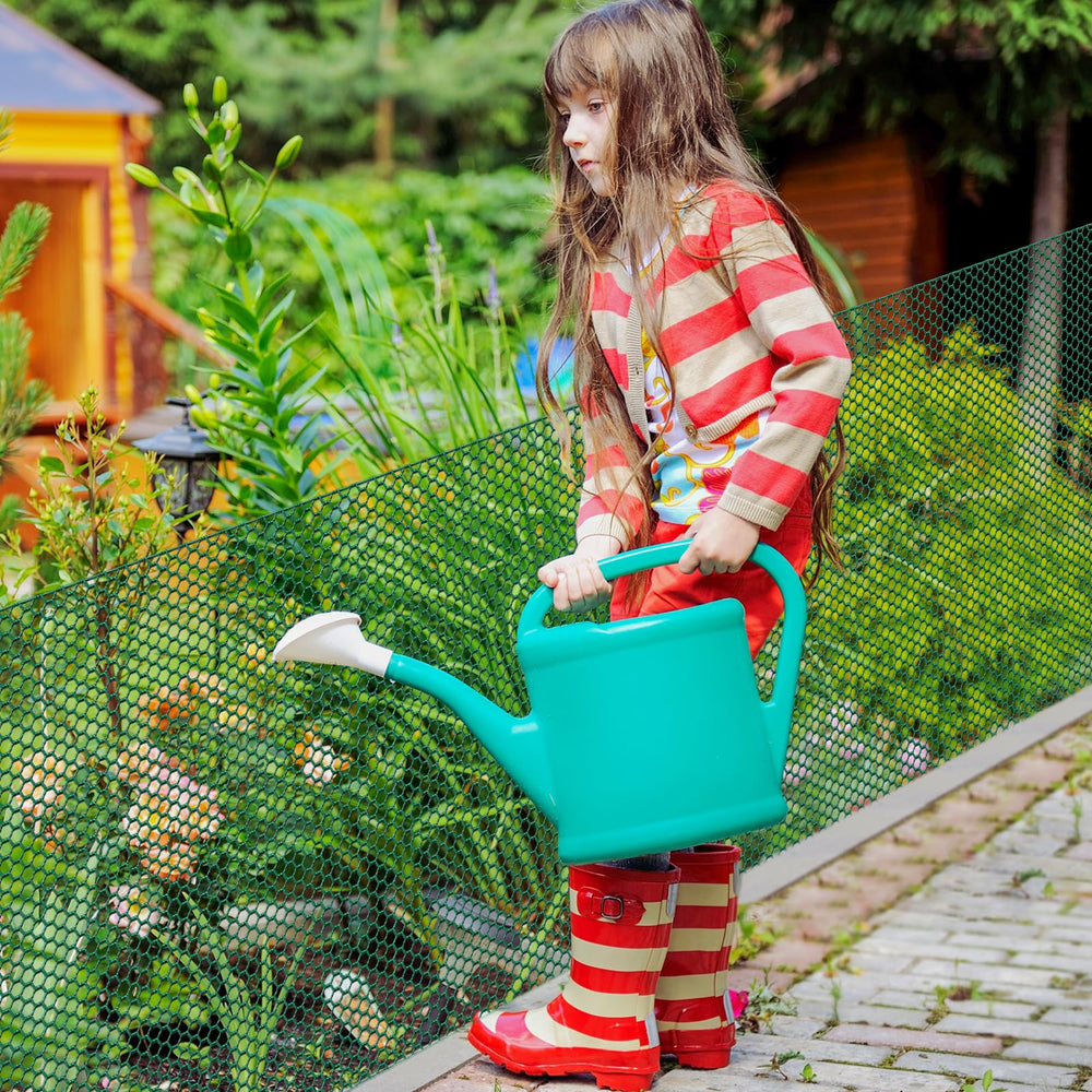 UJG roll next to trowel and watering can showing real-world scale and versatility