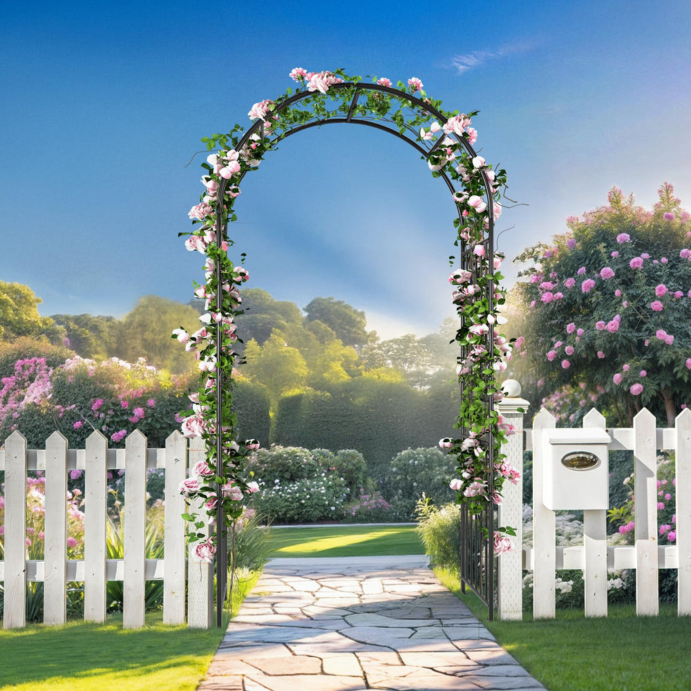 Ultym arch placed on backyard pathway enhancing garden focal point