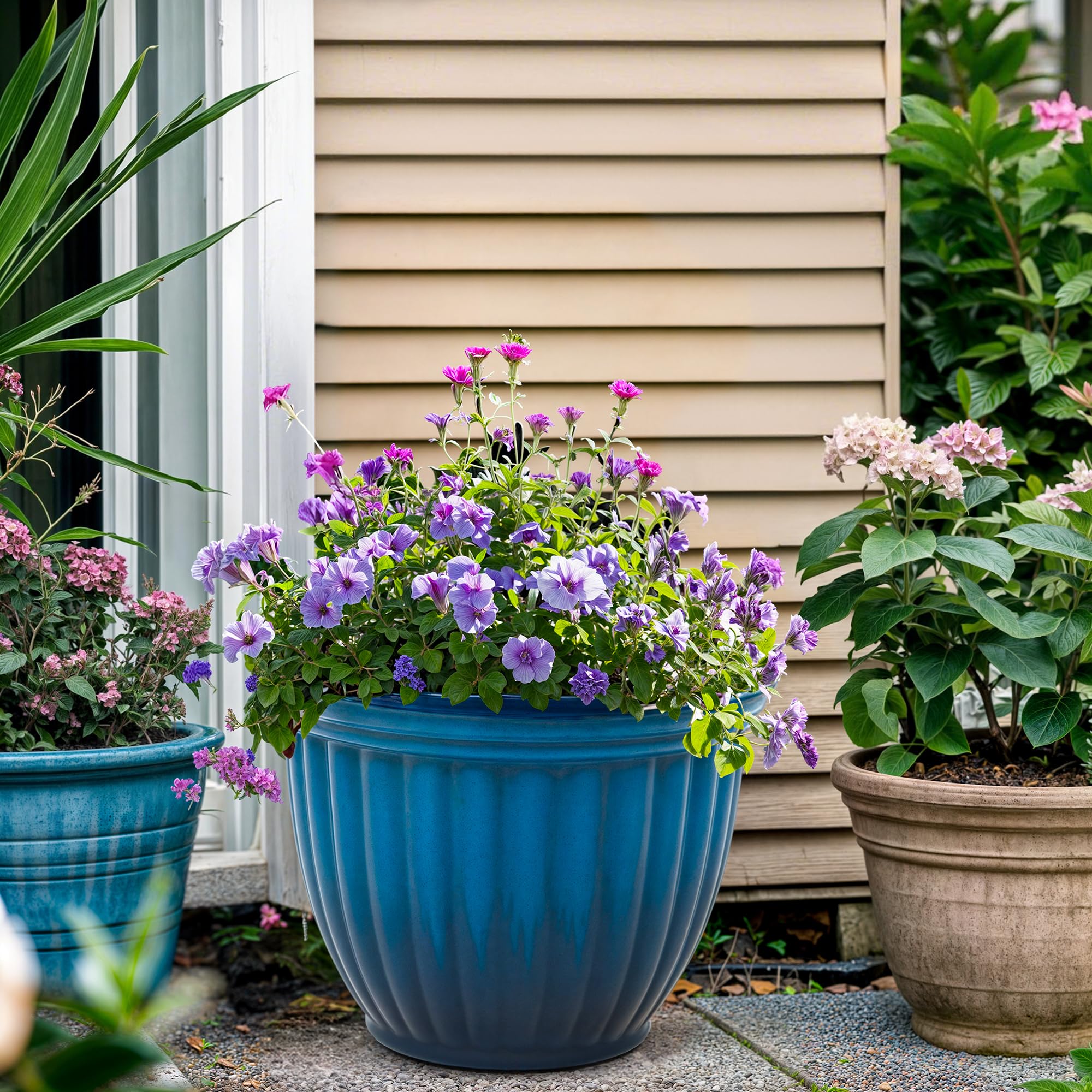 Ultym planter on patio with flowering plant showcasing outdoor styling benefit