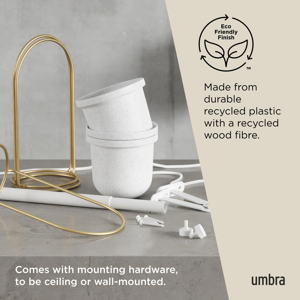 Umbra Triflora filled with kitchen herbs, Umbra makes harvesting and watering easy