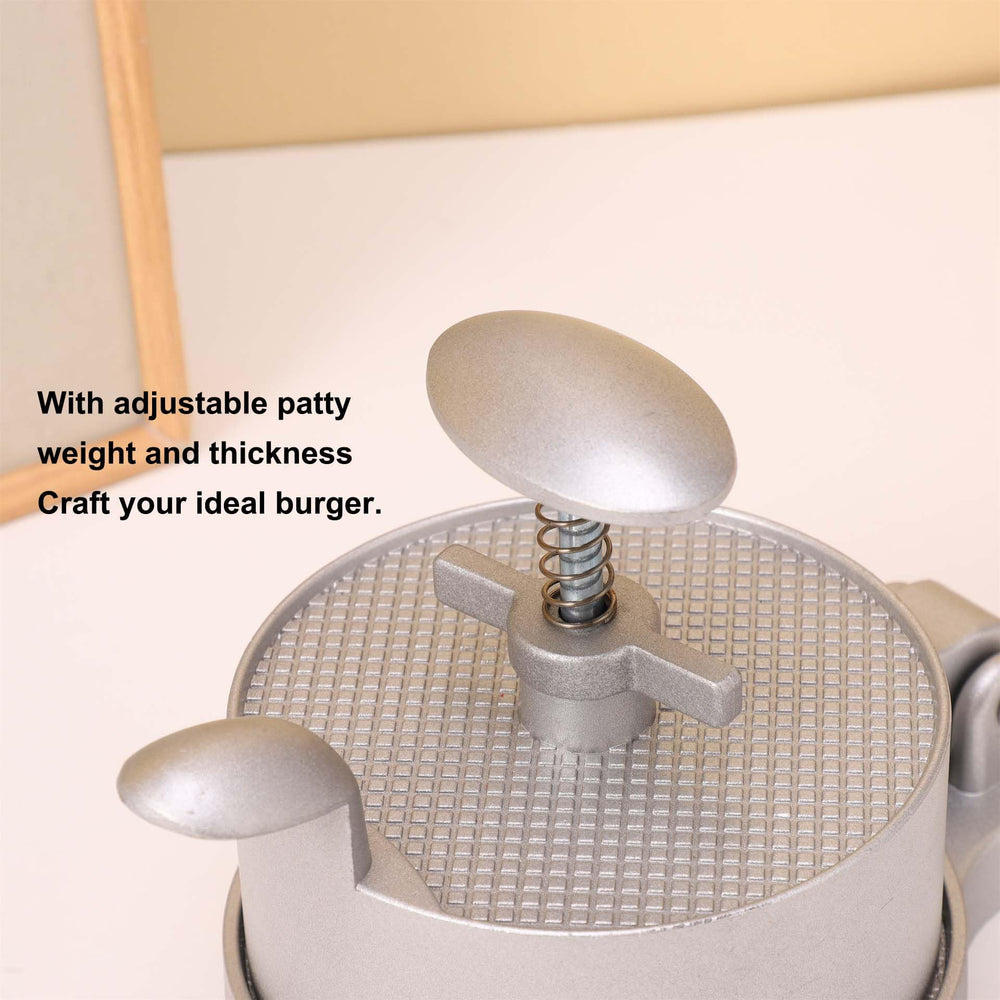 UNI-RHYTHM spring ejector lifting patty cleanly for no-mess removal