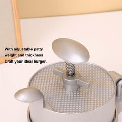 UNI-RHYTHM spring ejector lifting patty cleanly for no-mess removal