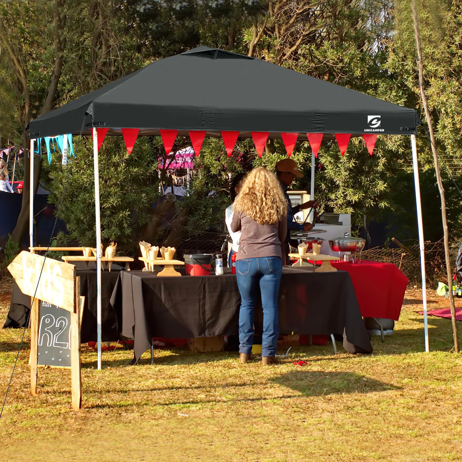 UNICAMPER canopy top at a market booth providing shade and a professional display