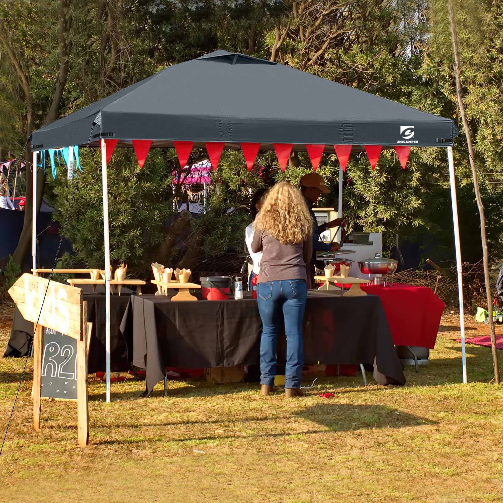 UNICAMPER canopy top in outdoor market scene highlighting shade for vendors