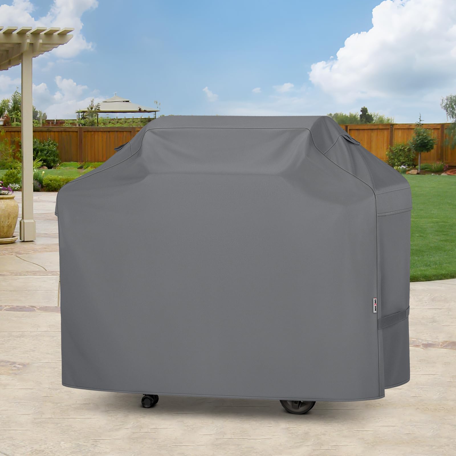 Unicook backyard scene with cover on grill keeping patio tidy and ready