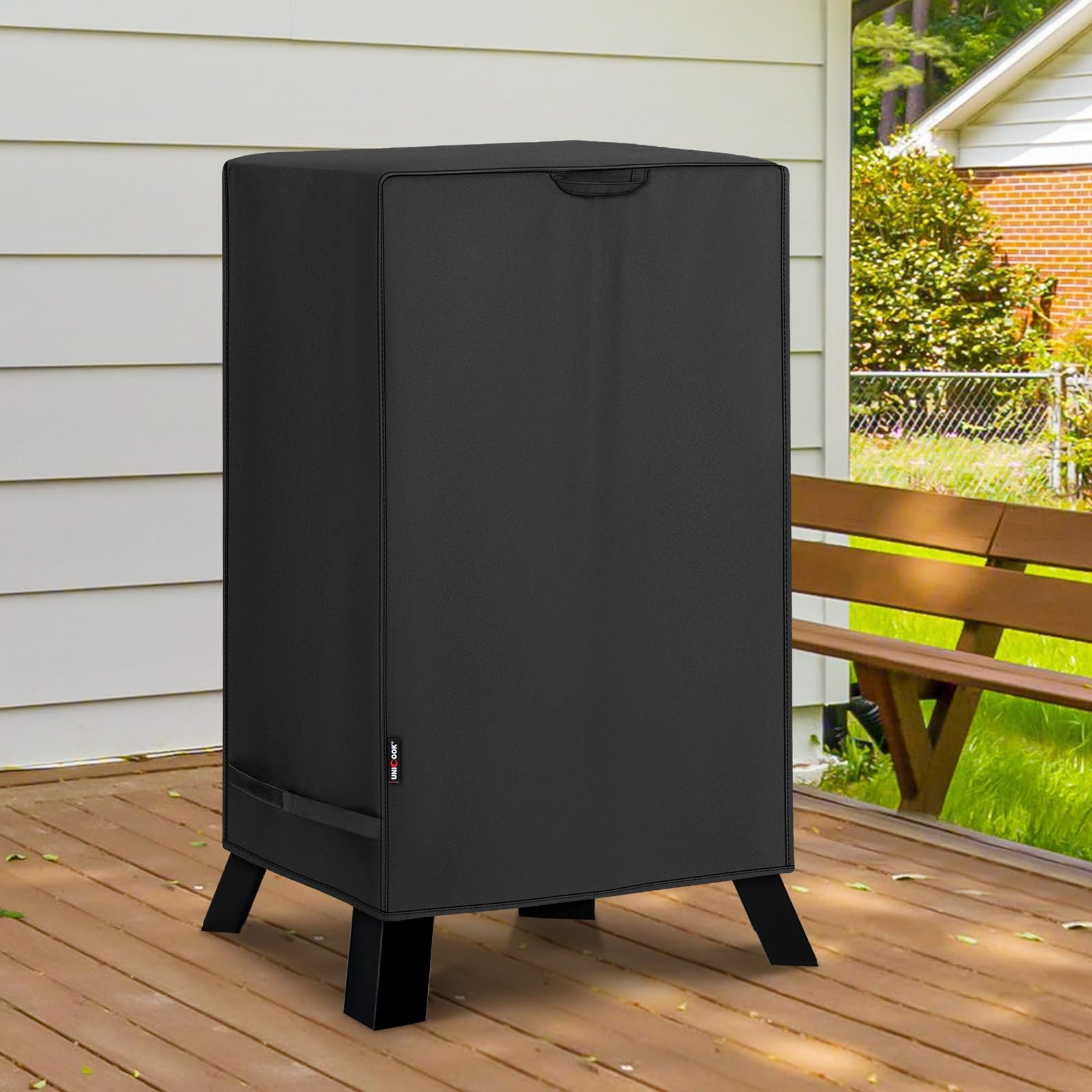 Unicook covered smoker in backyard demonstrating all-weather protection benefit