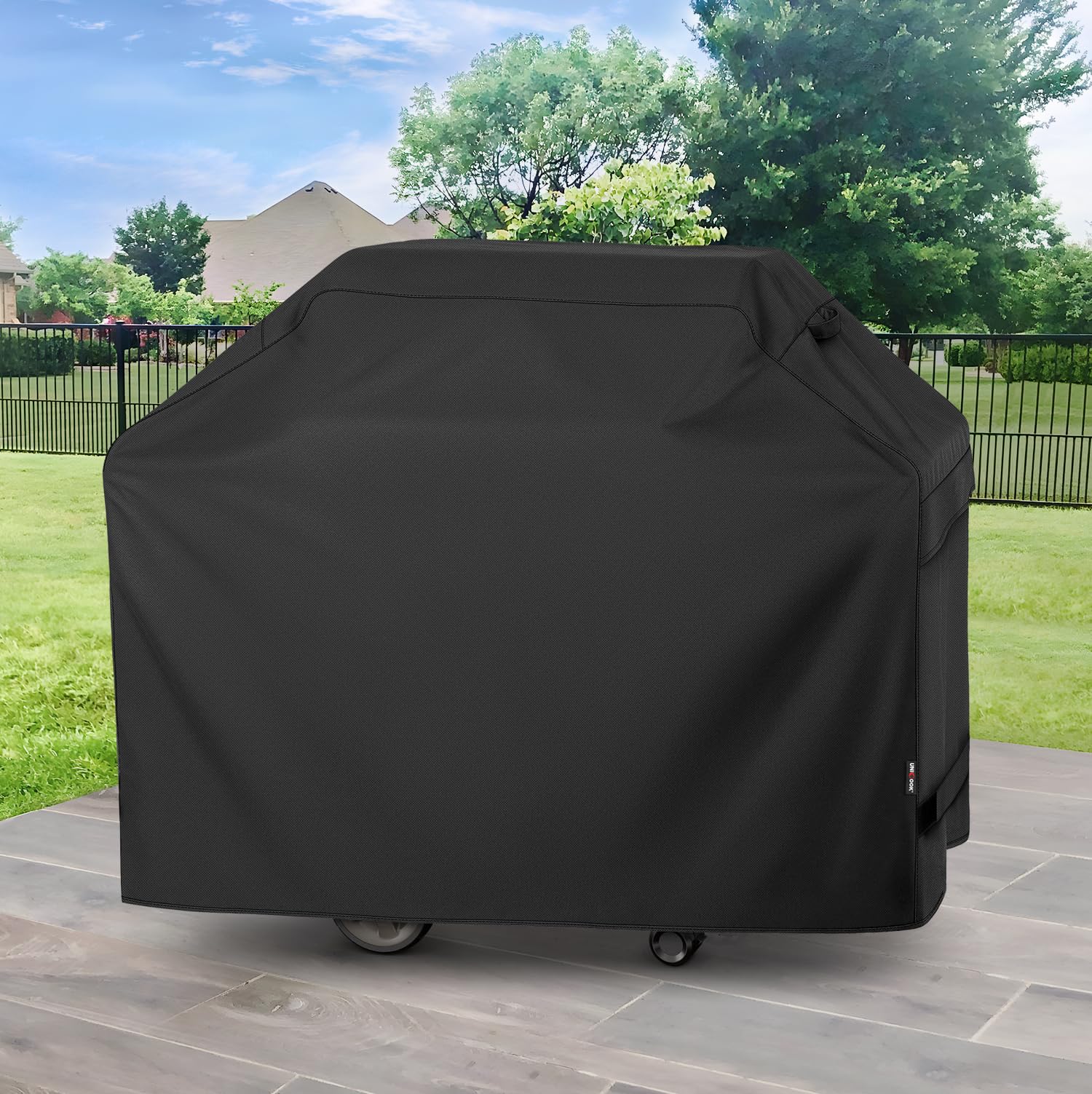 Unicook cover shedding rain and snow to demonstrate waterproofing