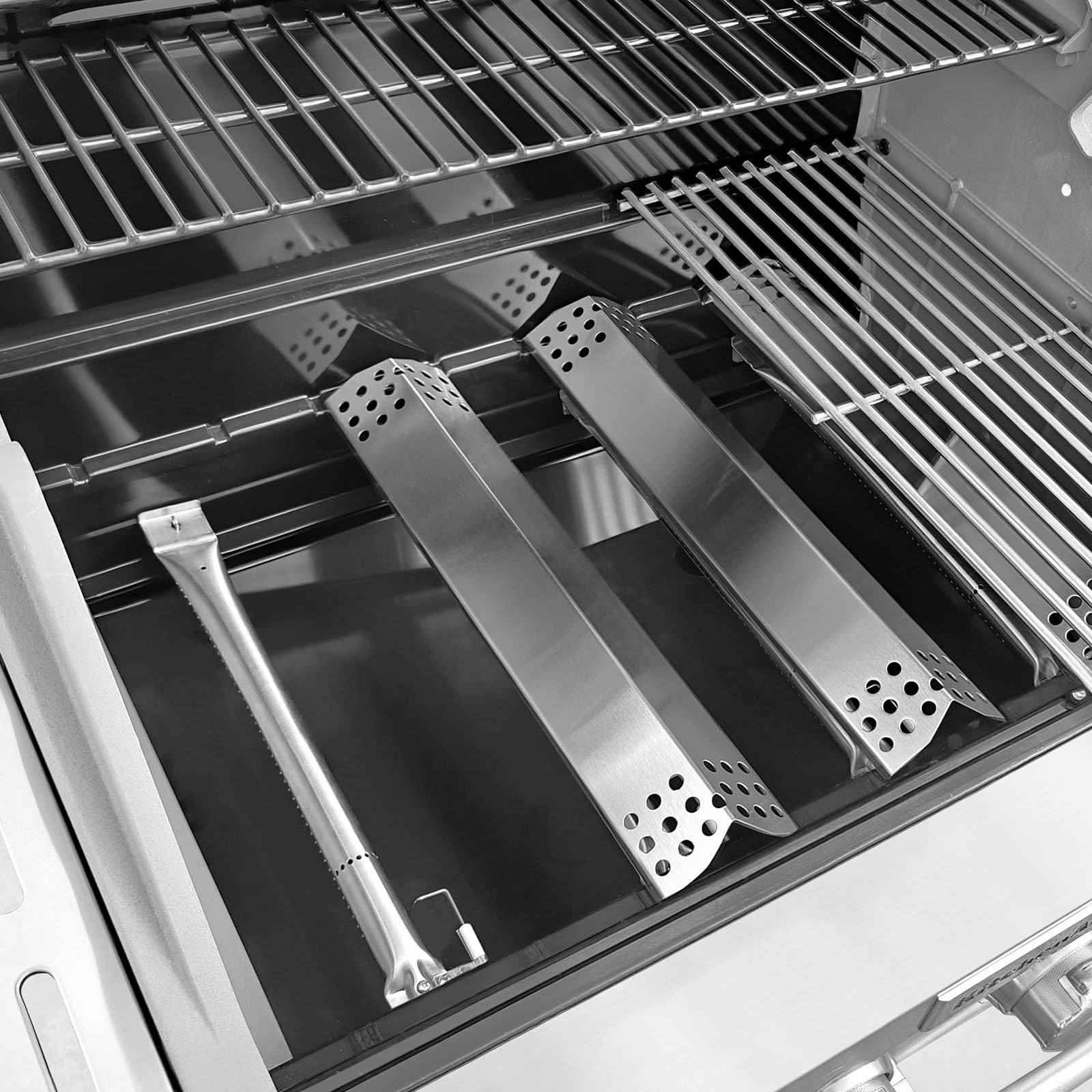 Uniflasy parts installed in grill illustrating restored flame pattern and even cooking