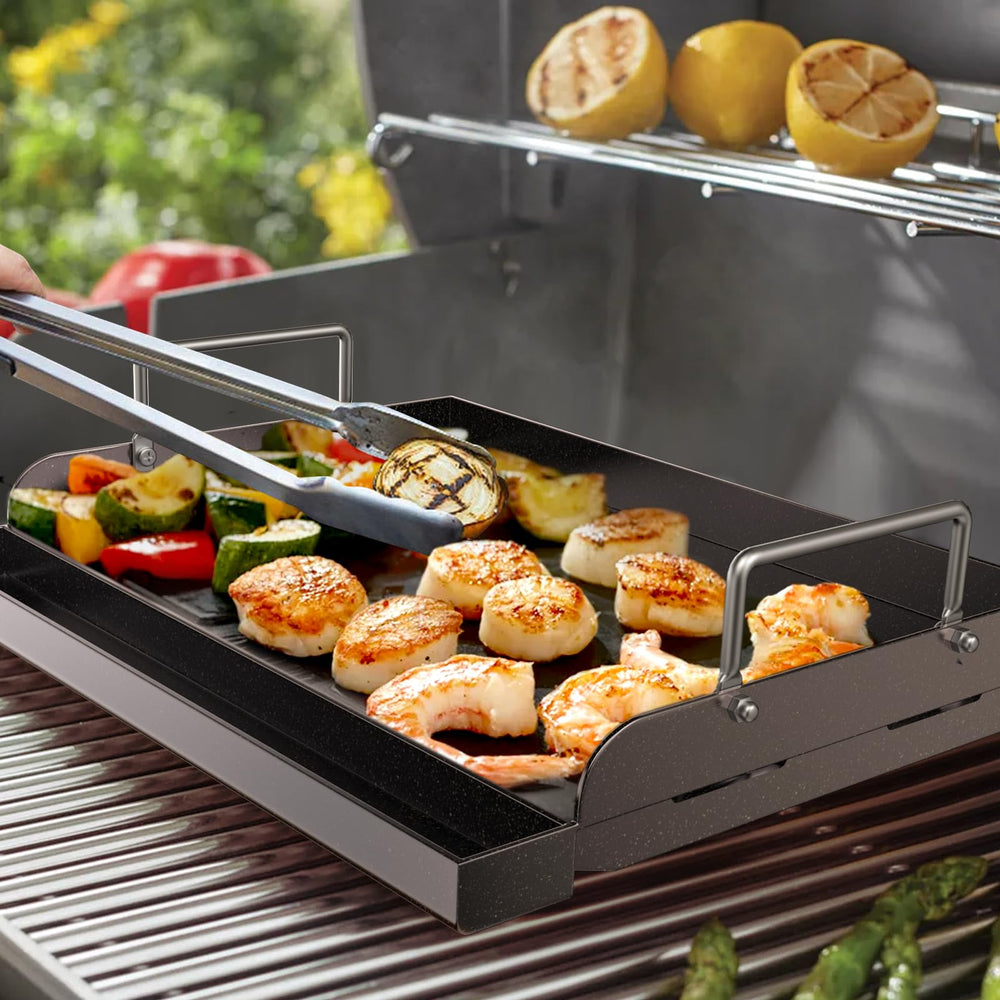 Side view of Uniflasy griddle showing grease trough and high-bar sides for splash control
