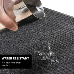 UNIMAT low-profile mat under door showing flush clearance that prevents tripping