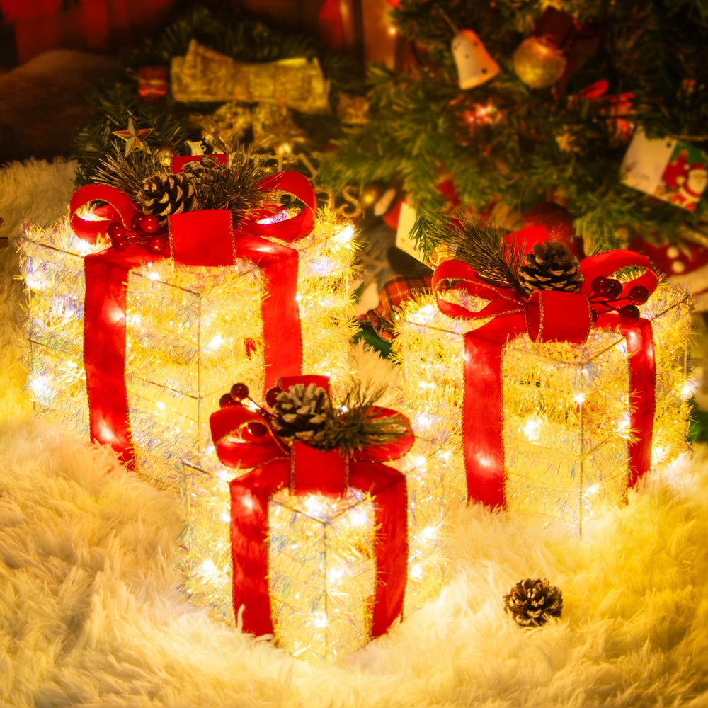 UNUSROOM front view of three lighted gift boxes showcasing warm glow