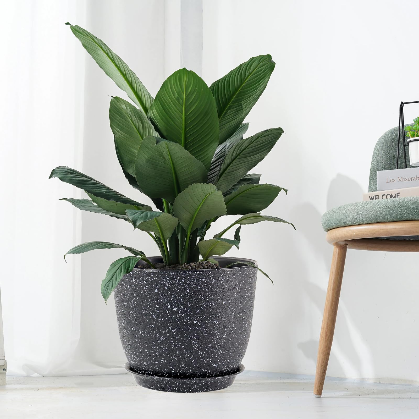UOUZ displayed on a patio with flowers illustrating outdoor durability and aesthetic appeal
