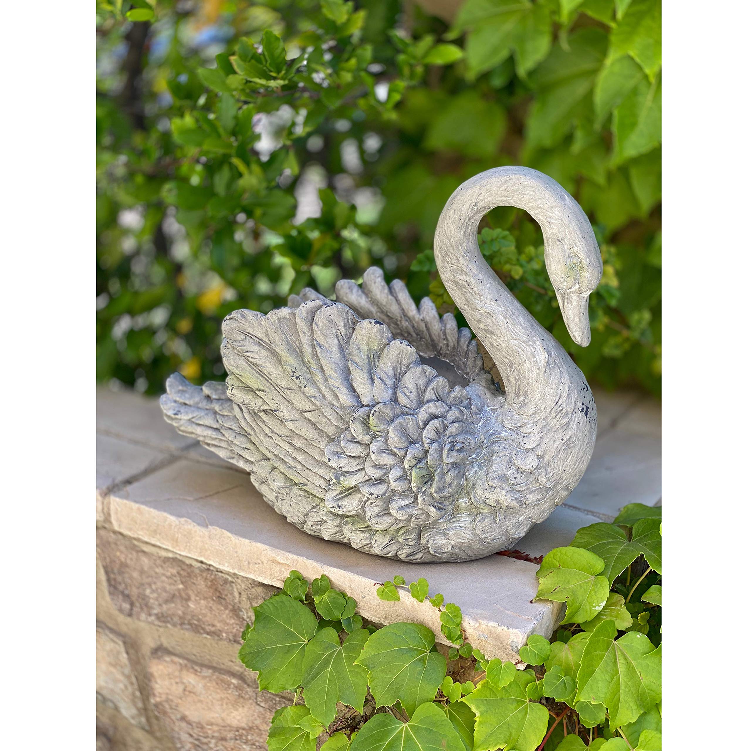 Urban Designs swan planter beside a garden pot illustrating true scale
