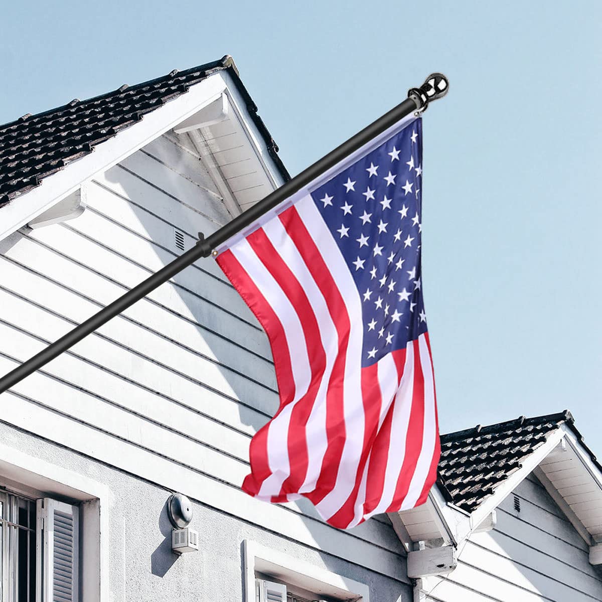 USA Flag Co. flagpole next to doorway showing 6-foot scale and space fit