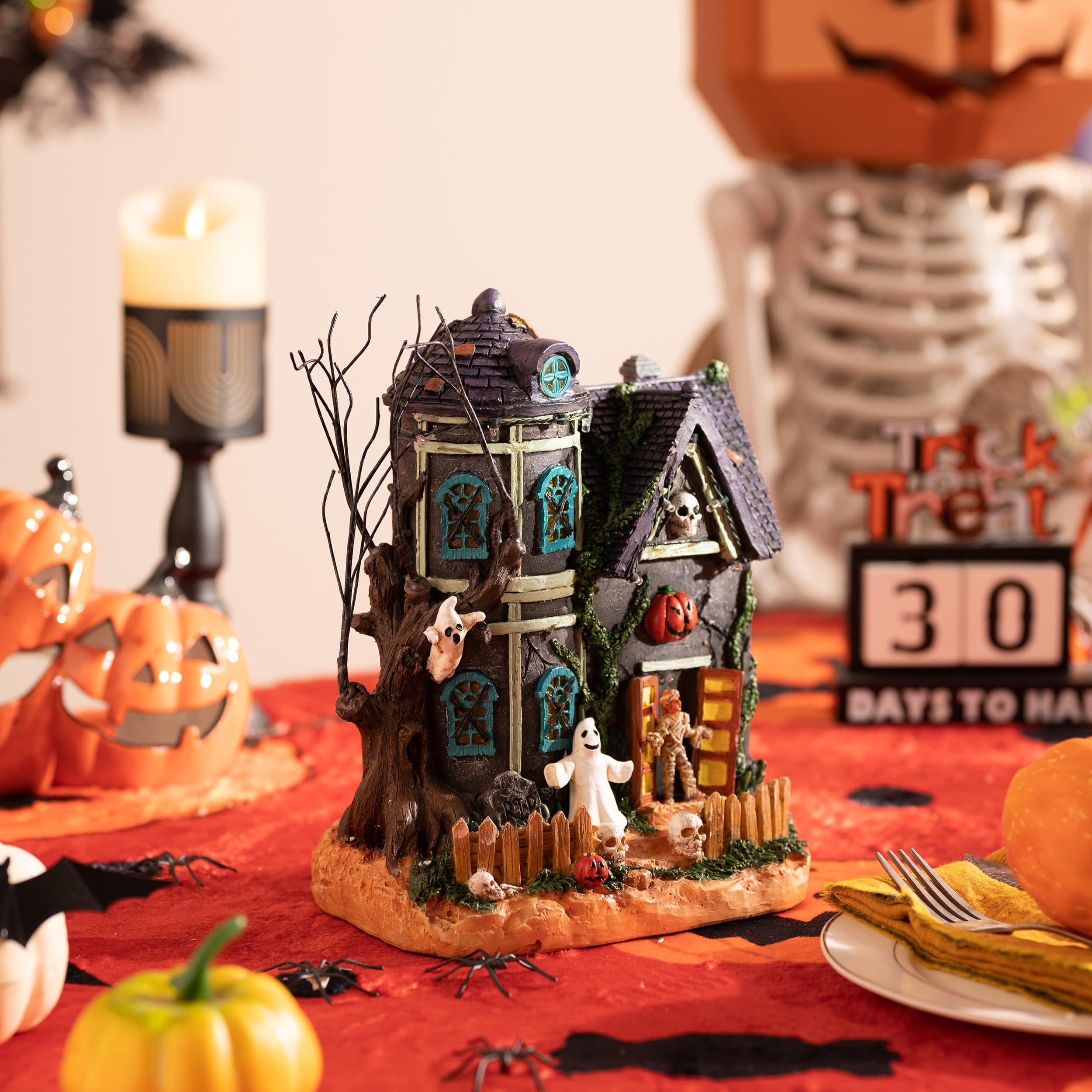 Valery Madelyn styled on shelf with candles to boost Halloween display
