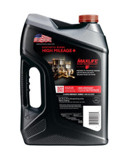 Valvoline bottle being poured into engine bay demonstrating easier maintenance