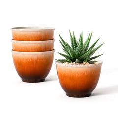 Vanslogreen front view of four glazed 8-inch planters showing coordinated colors and style