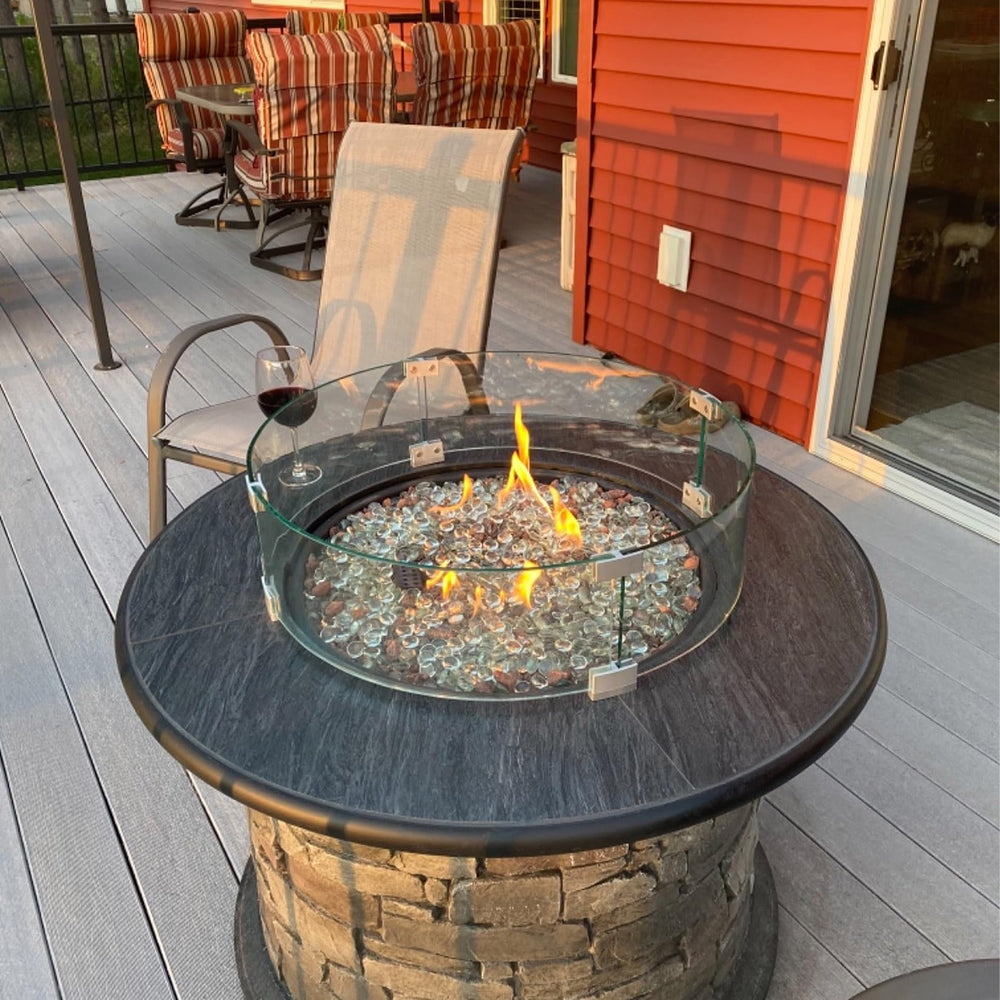vchin lifestyle backyard setting with wind guard in use showing stable flame enjoyment benefit