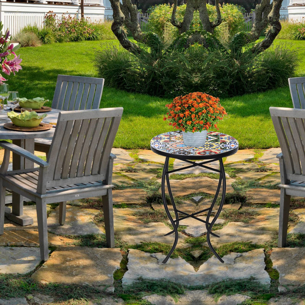 VCUTEKA table beside patio chair showing scale and how it saves space on small decks