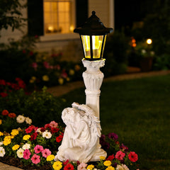 VEEKI angel front view showing elegant statue and solar lantern benefit ambiance