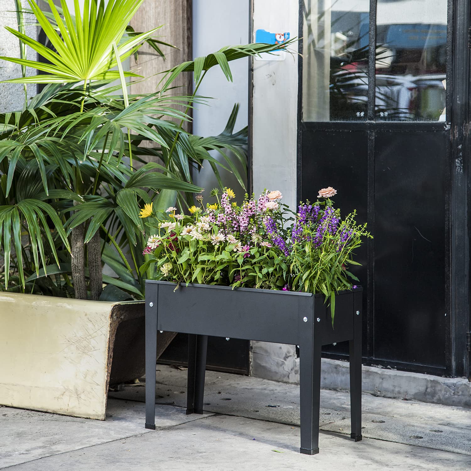 VEOAY lifestyle on balcony with herbs and flowers showcasing space-saving gardening