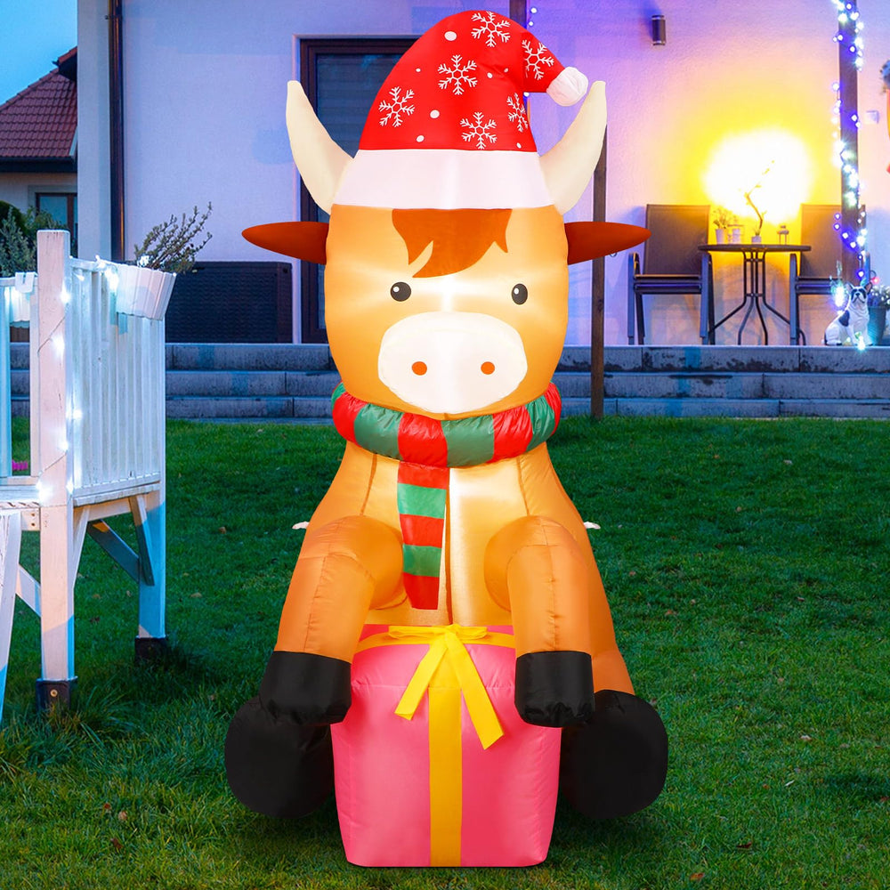 Vertintong front view highland cow showing cheerful holiday décor and curb appeal