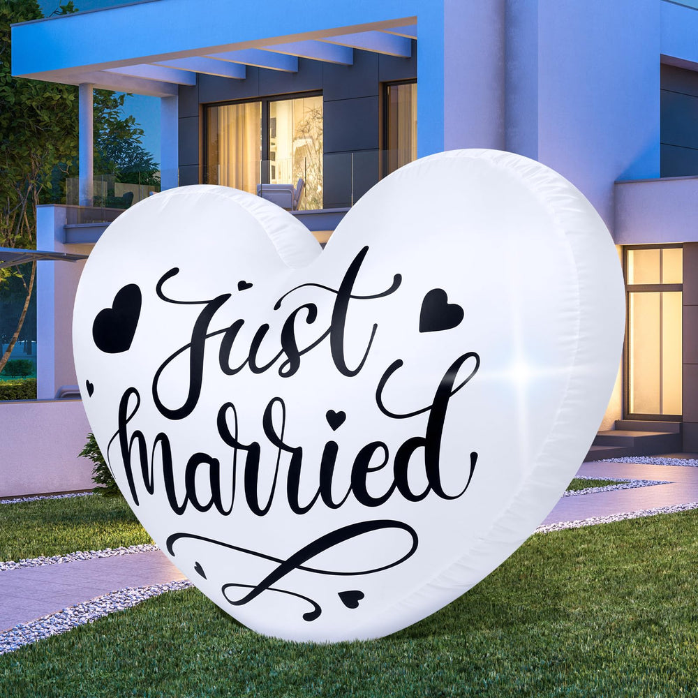 Vertintong front view of inflatable heart showing "Just Married" text and curb appeal