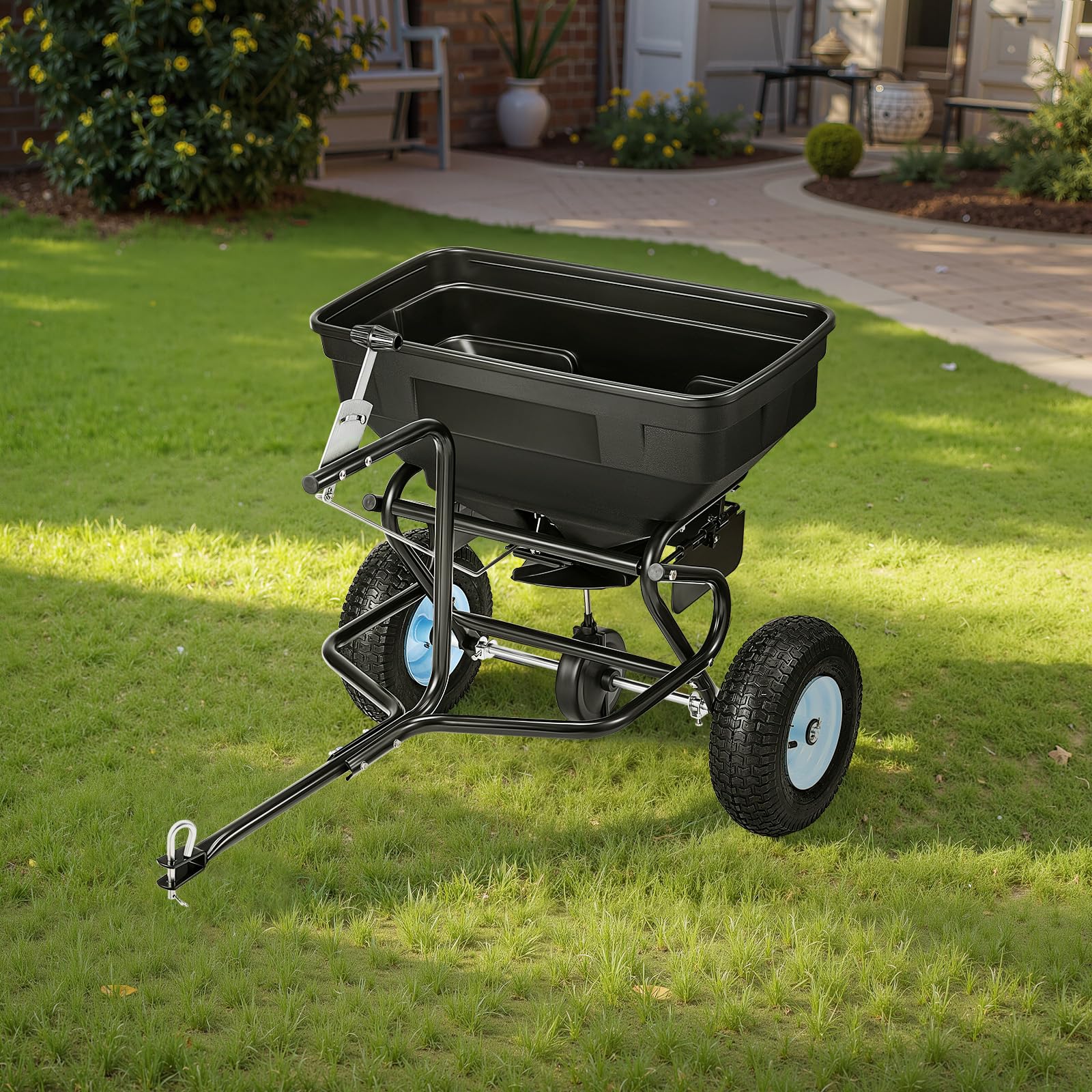 VEVOR spreading on lawn demonstrating wide 9.8-foot even coverage