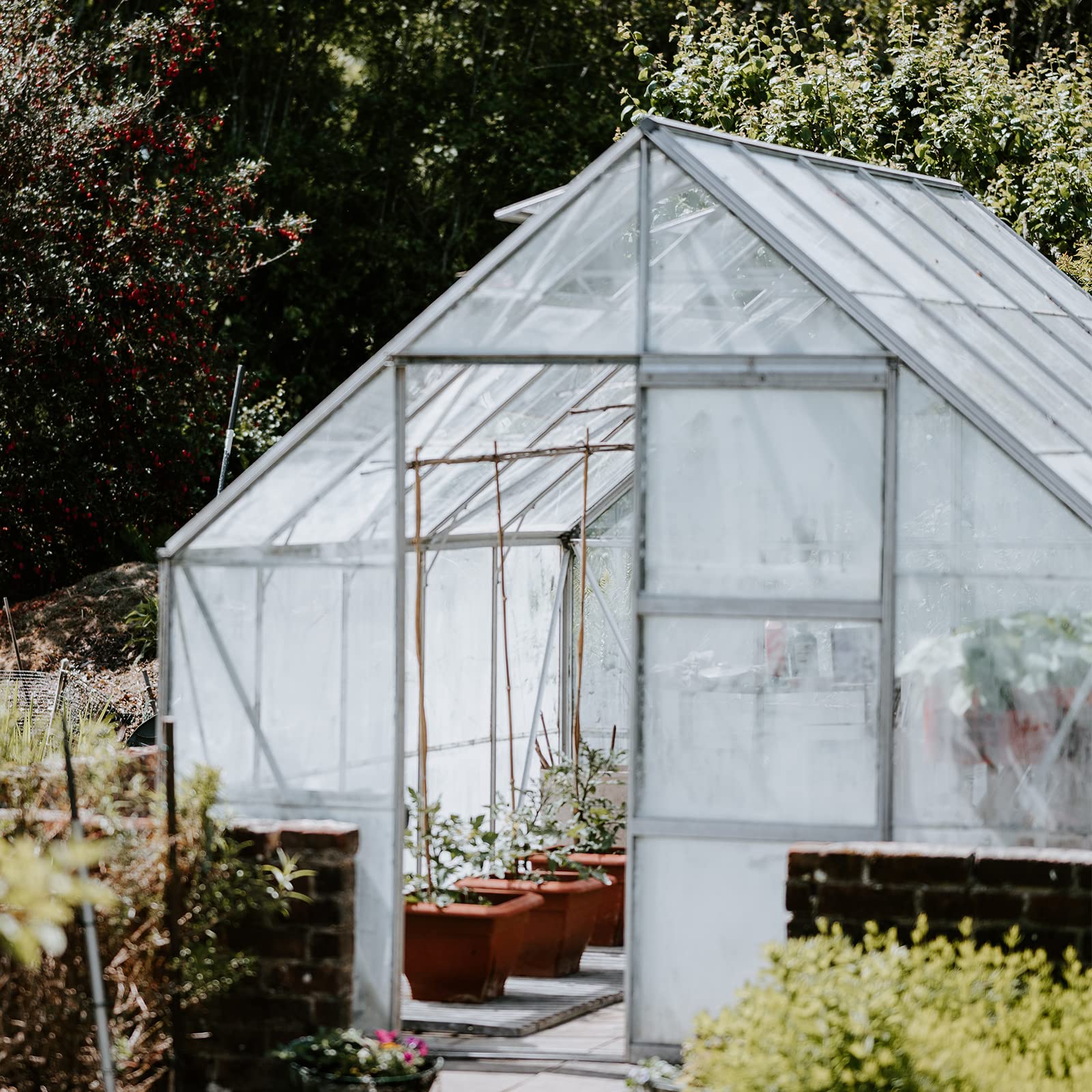 VEVOR film covering garden beds in lifestyle setting for seasonal use