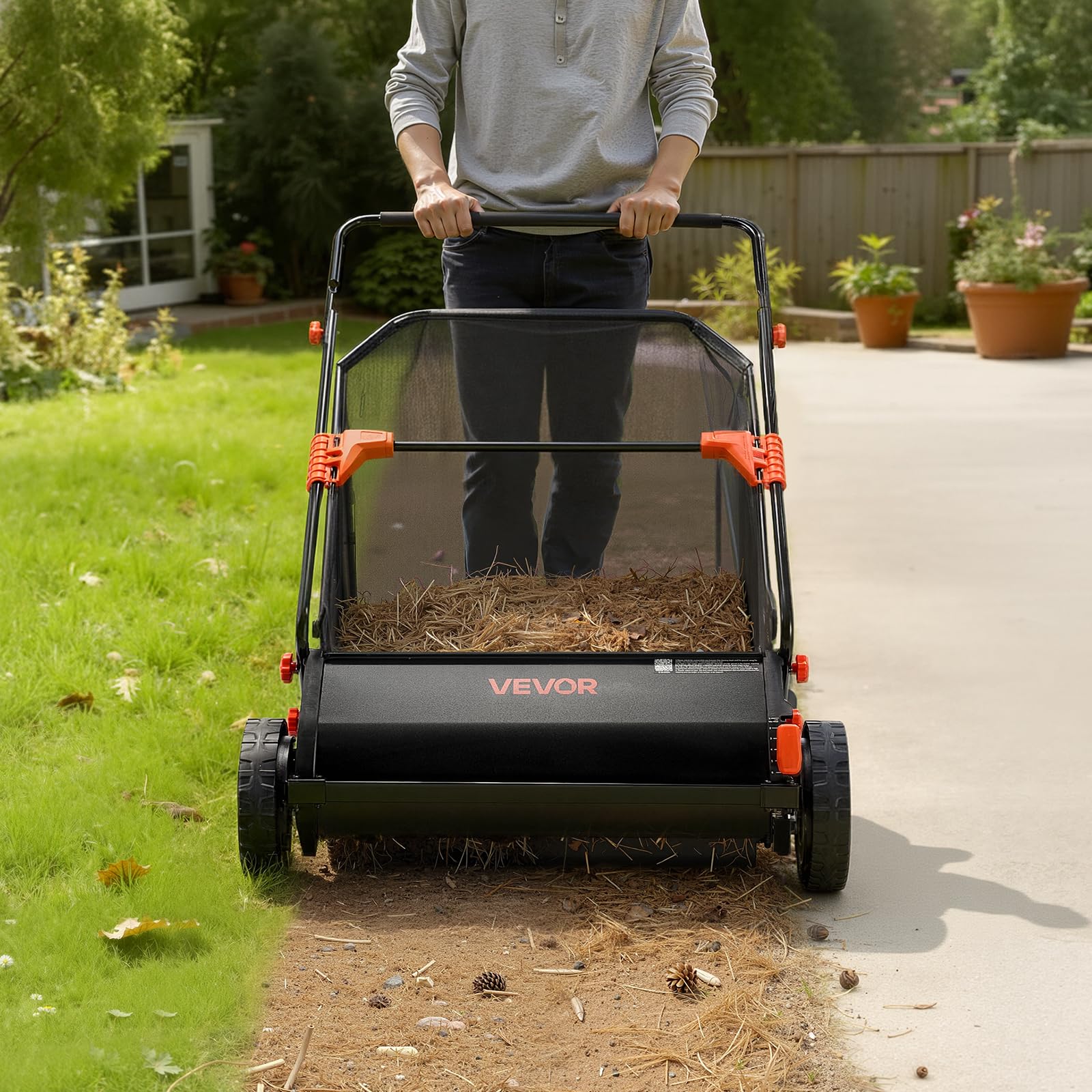 VEVOR sweeper beside a homeowner for scale showing 30-inch width and 12 cu ft capacity
