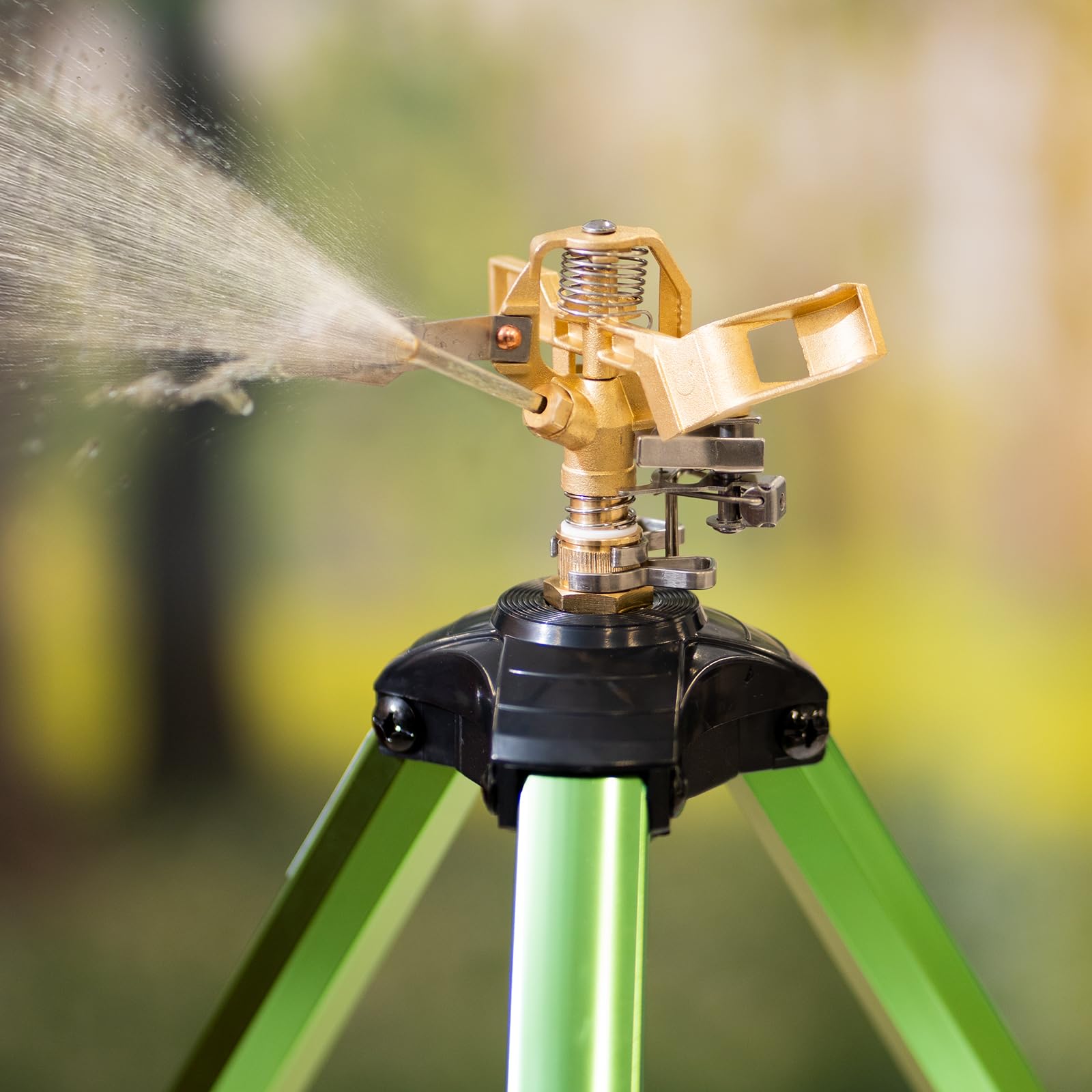 VEVOR sprinkler next to ruler for scale demonstrating compact transport and setup