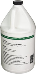 Vf-11 1-gallon bottle beside potted plants demonstrating easy garden use