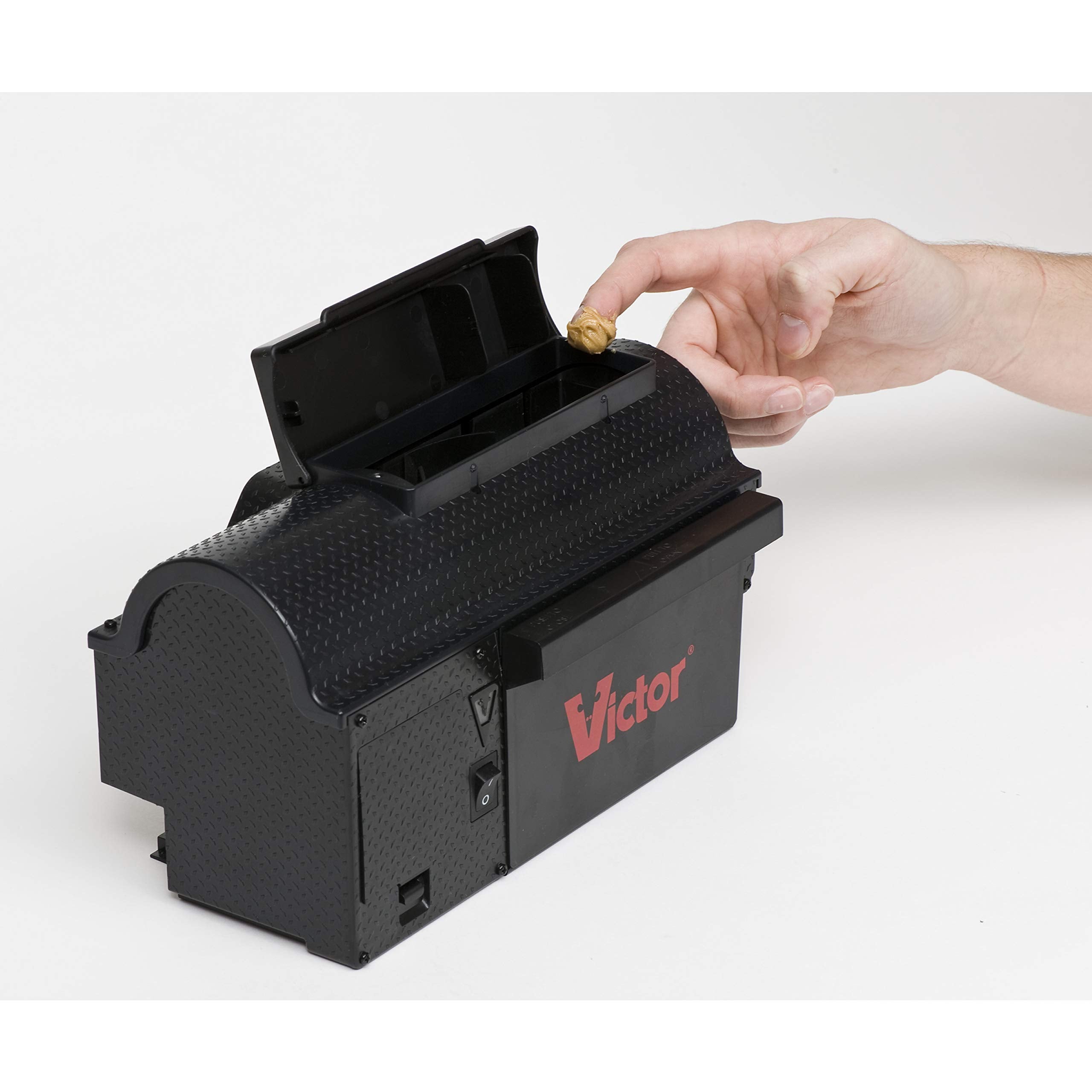 Victor trap placed in kitchen corner showing discreet indoor use and placement benefit