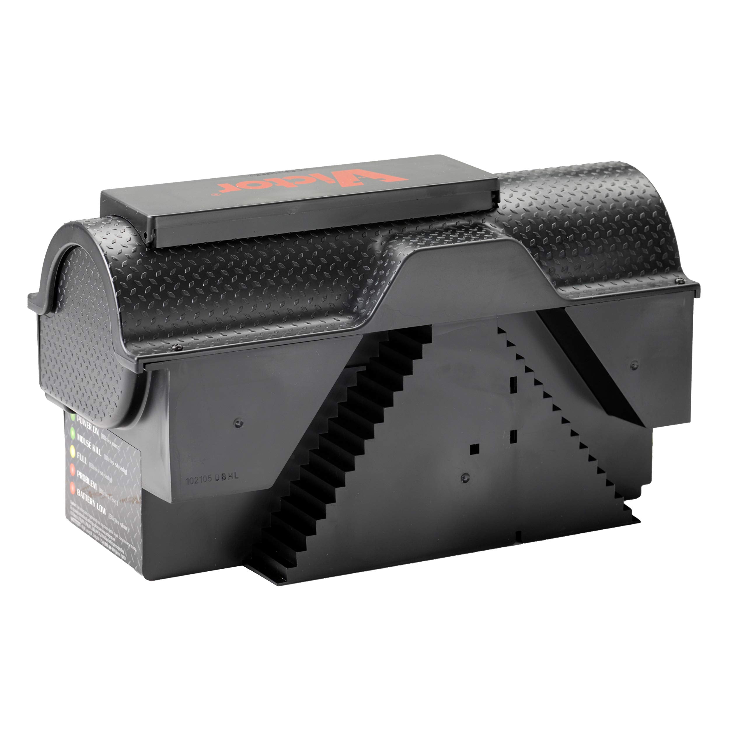 Victor trap beside hand to show size and easy placement for household use