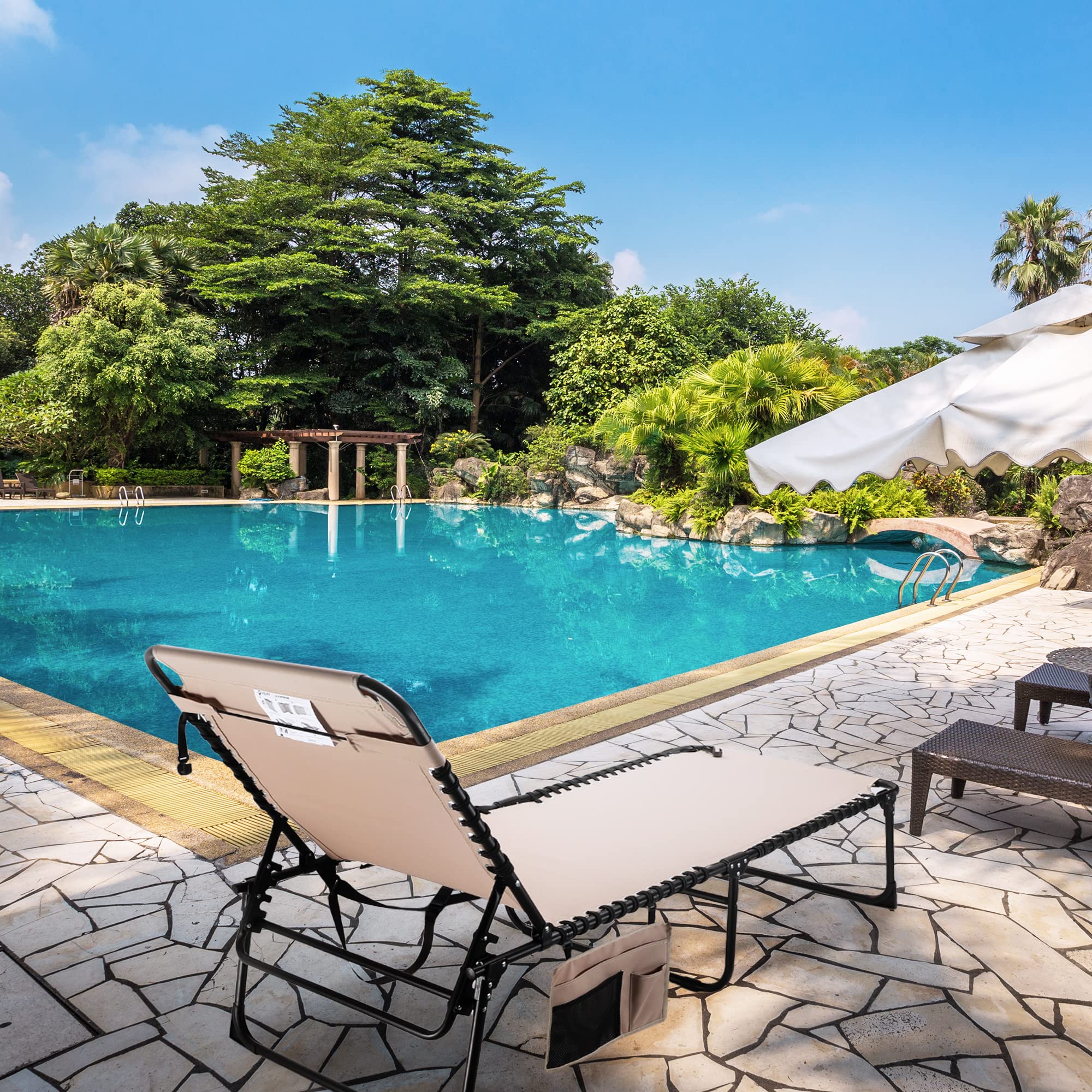 VILLEY chaise lounge in use poolside showing comfortable reclining outdoors