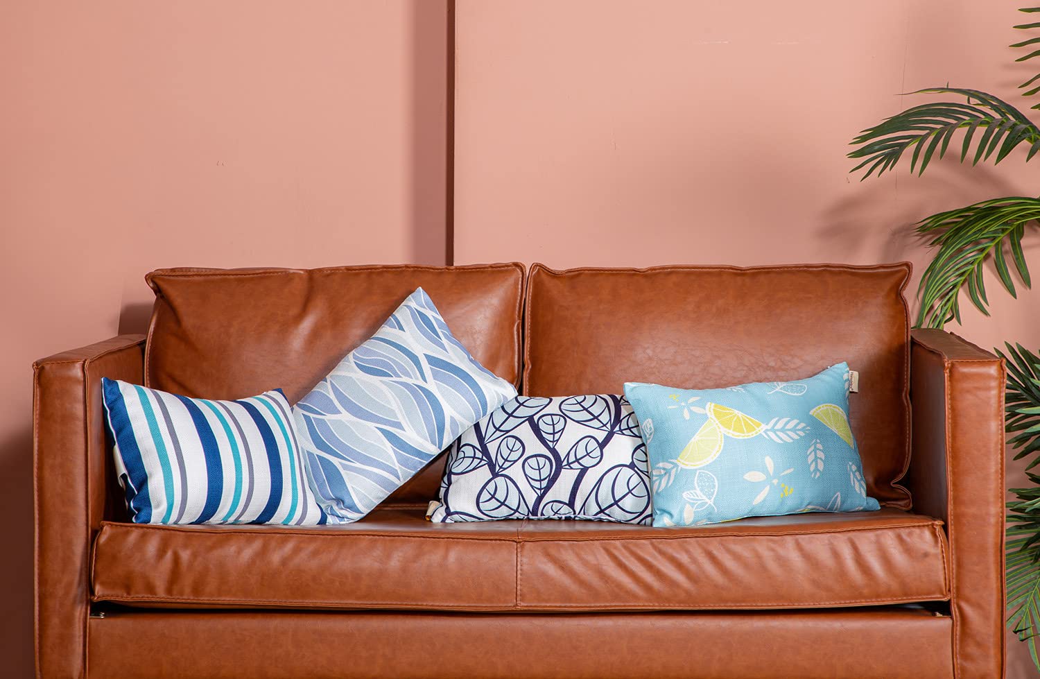 vmgreen pillow beside a ruler showing 11x16 size for travel and chair fit