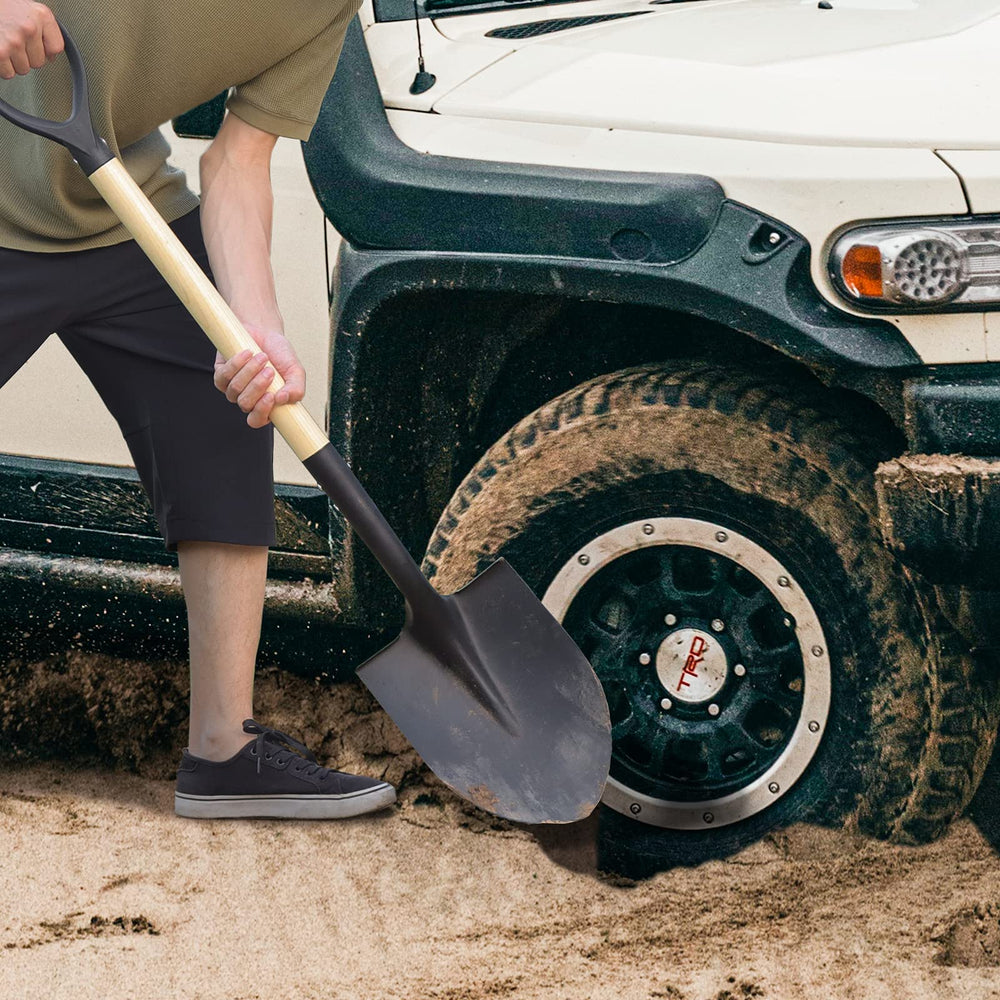 VNIMTI shovel at beach campsite for versatile outdoor utility