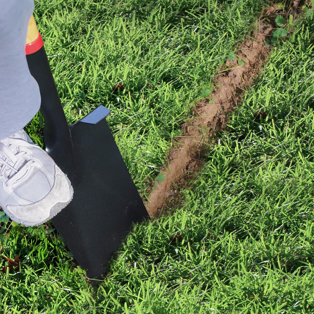 VNIMTI shovel slicing turf demonstrating clean edging and sod removal benefit