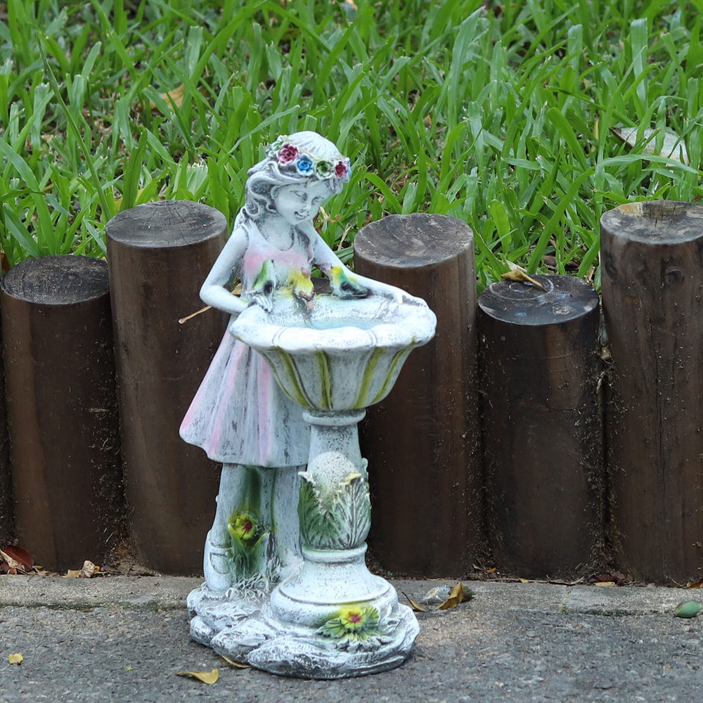 voveexy fairy statue placed in flower bed creating cozy evening ambience