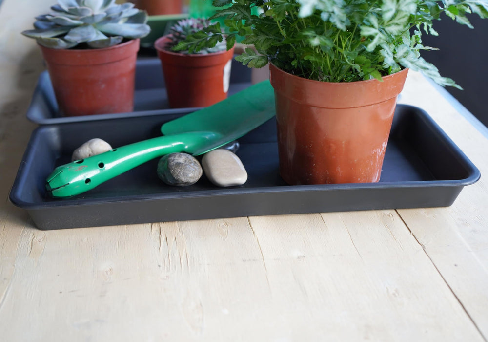 VUWEZ tray next to ruler size comparison illustrating exact dimensions for pot fit