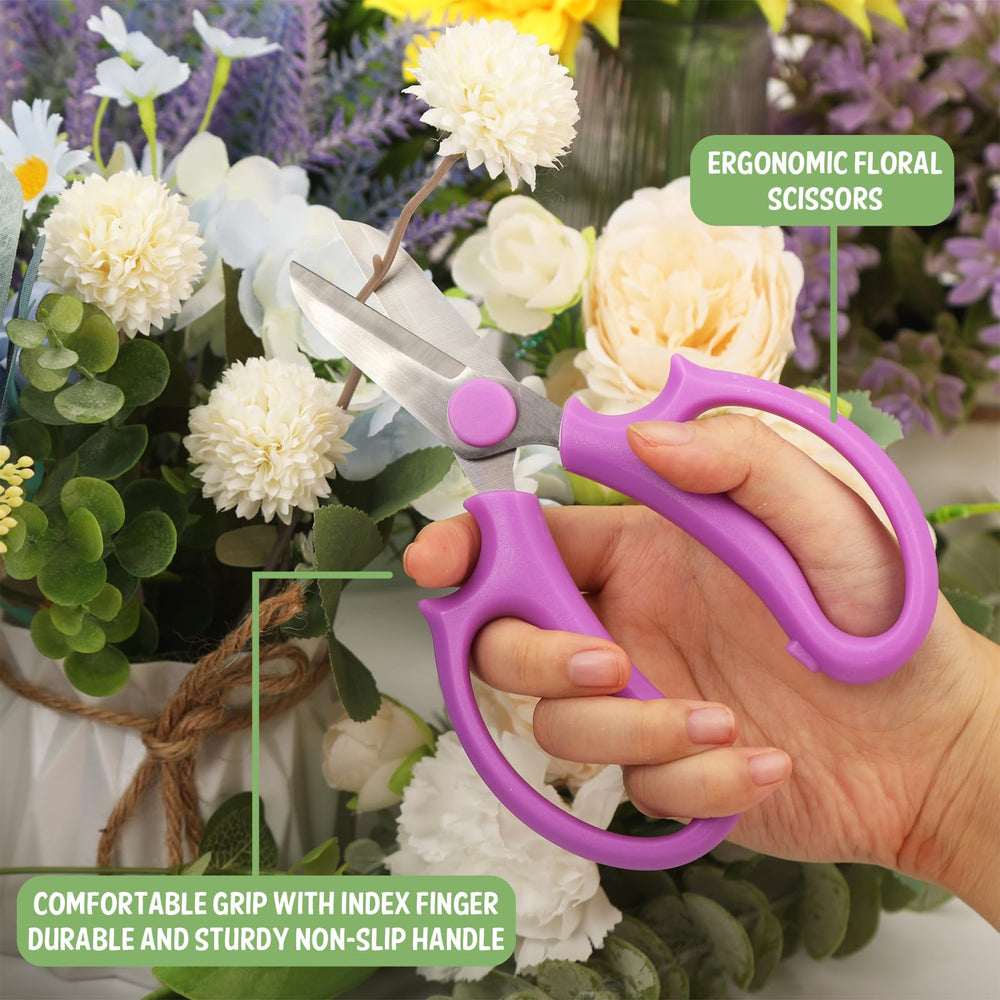 VZZNN scissors held in hand showing compact 6.5-inch size and ergonomic grip
