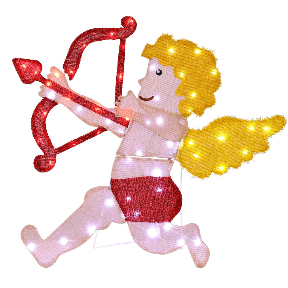 W Empty Cupid illuminated in yard at night creating romantic curb appeal